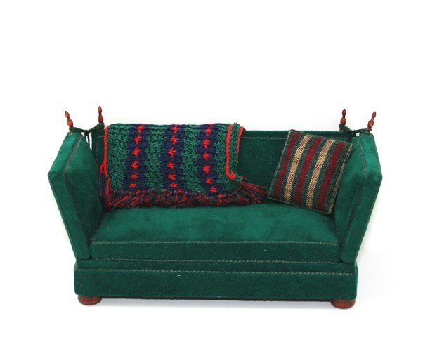 Ray Whitledge Knoll Sofa: Upholstered in forest green ultra suede, an elegant Knoll sofa 3.5" H, 7" L, accessorized with a hand knit throw and loose pillow, signed by the artist in 1994