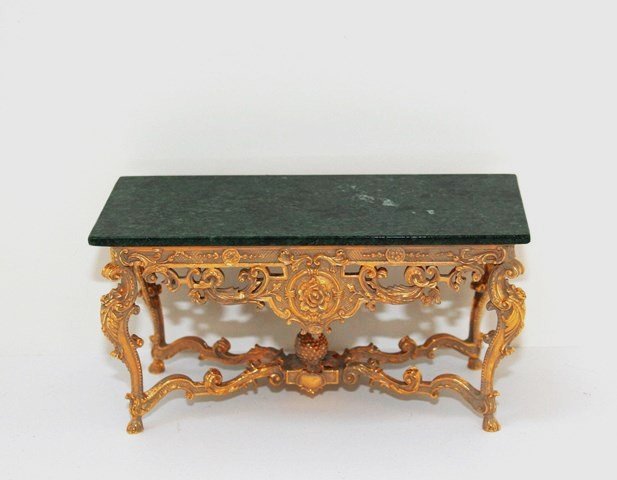 John Hodgson Table: Very ornate gilt table with green marble top. 2.75" H, 5.5" L. The gilt metal base appears to have been given a taupe wash, probably by Ray Whitledge, to complement the daybed in Lot 192.