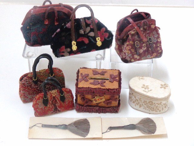 Carry-on Luggage: Carpet bags, hatboxes and brushes. Largest bag 1.5" H, 2" W.