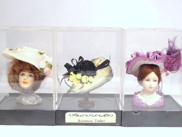 Glam Chapeaux: A Gibson Girl hat on a glazed porcelain head with wig 2.25" H, a Pat Stevens hat on mannequin and a Rosemary Tucker hat on stand.