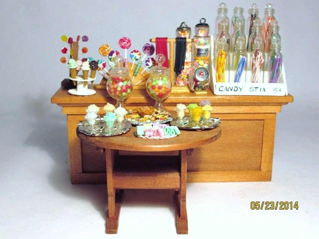 Ice Cream and Candy: More candy in jars as well as ice cream cones, sundaes and lollipops to last a lifetime. Nice shop counter 2.75" H, 7" L and a Fomerz settle/table.