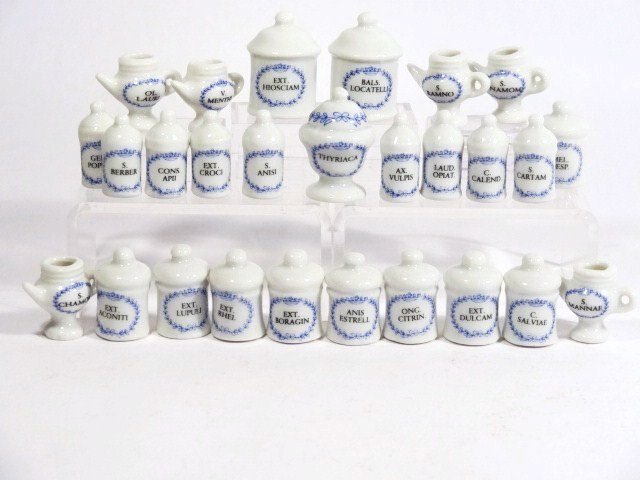 Apothecary Jars: 27 - count 'em - 27 blue and white china apothecary jars labelled in Latin, unsigned, tallest 1 and 1/8" H, some lids missing.