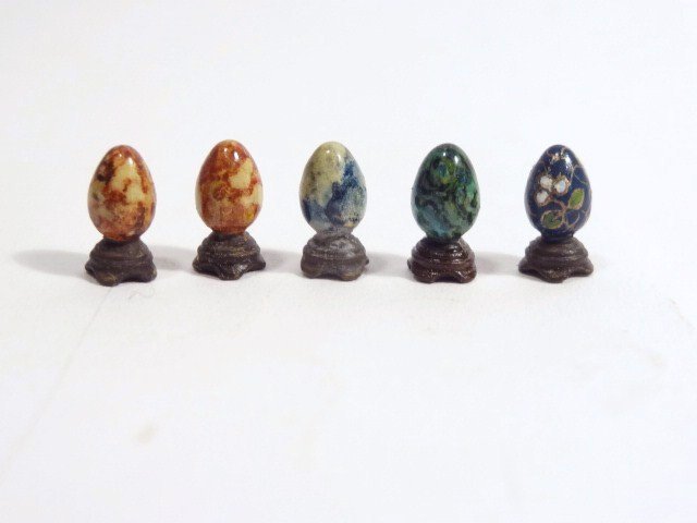 Emily Good Decorative Eggs: Five miniature stone and cloisonné eggs made from hand-painted brass by the late Emily Good 3/8" H and featuring amazing detail, in original cases with documentation.