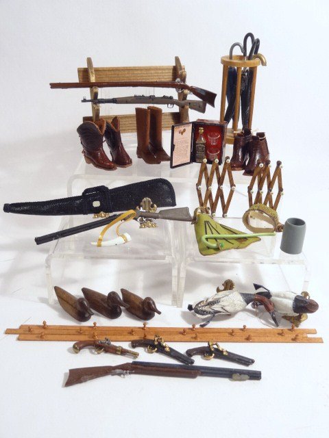 Sportsman's Stuff: Rifles and gun rack, folding hat racks, scuba gear, pistols, private whisky case, umbrella stand with umbrellas, decoys and dead ducks, boots. Umbrella stand 2 and 3/8" H.