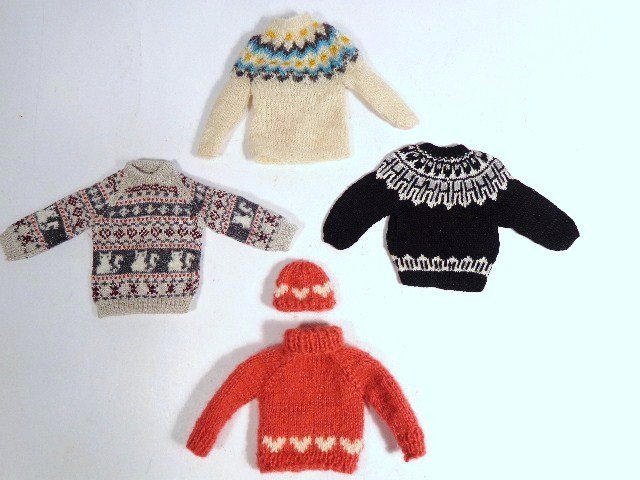 Artisan Knitwear: Four superb miniature knitted sweaters, one with matching cap, about 2" H, very fine gauge.