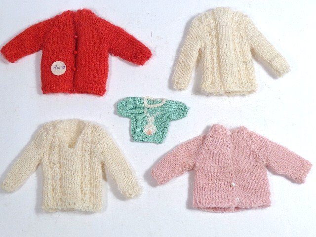 Tiny Sweaters: Four delightful knitted sweaters and a knit baby sweater, all very fine gauge, about 2" H.