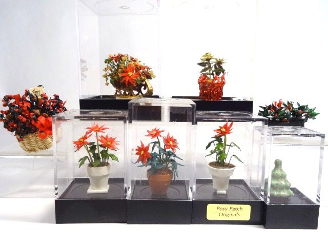 Christmas Plants: Artisan poinsettias and gift baskets and a small ceramic Christmas tree. Tallest 2" H.