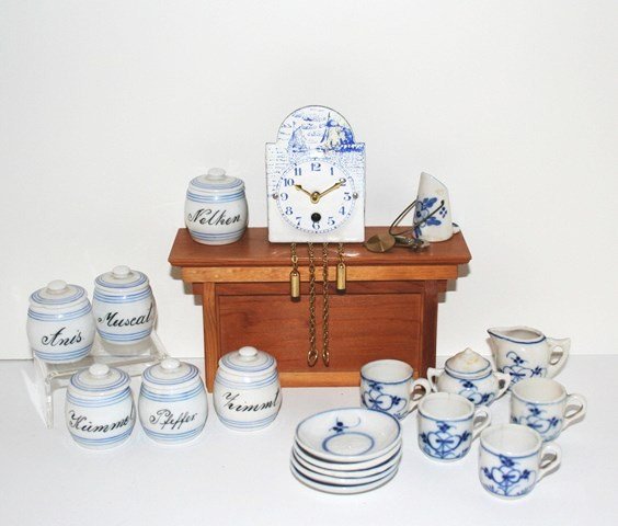 Antique German Kitchen China: Six cute German porcelain canisters with lids (two lids chipped) , unmarked. 1.5" H, nice for a larger kitchen roombox. Also a wind-up clock 3" H with pendulum (not tested) and antique Blue Onion tea