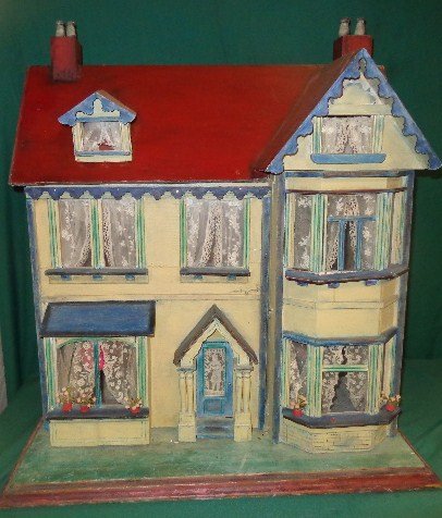 Victorian Doll House: Charming two-story Victorian doll's house, with attractive pastel colors, interesting vintage curtains and doorway. Opens from front to display four large rooms with vintage replacement wallpaper. Ext