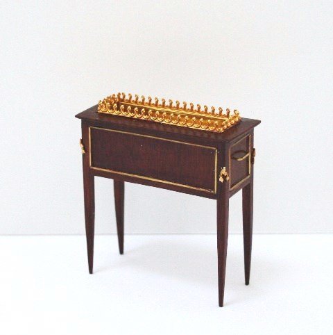 Herbillon Jardinière: A Louis XVI mahogany jardinière with brass liner, inlaid brass details and small ormolu mounts. 2.75" H, 2.5" W.