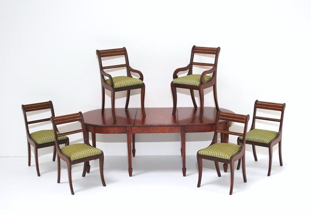 Dennis Jenvey Dining Set: Handsome Sheraton mahogany dining table with banded edging, extra leaf and six Regency chairs with striped silk upholstery. Table 2.25" H, 5.25" L expanding to just over 7" L.