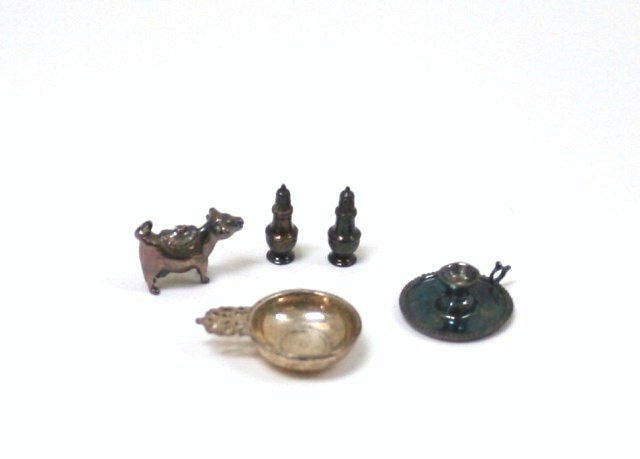 Acquisto Silverware: A pair of sterling salt and pepper shakers, porringer just under 3/4" L, candlestick and tiny cow creamer. Need polish.