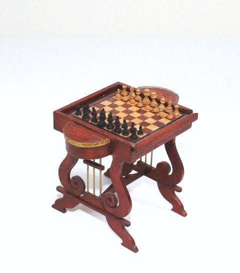 Julian Biggers Game Table: A remarkable feat of engineering, a delightful multi-purpose mahogany games table featuring a lyre-base supporting a chessboard table top that slides out to reveal a backgammon board. Two demilune hin