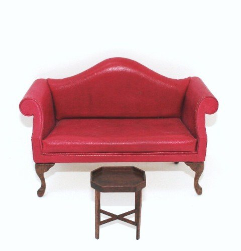 Beals and Gutheil Furniture: A red leather Queen Anne loveseat with tiny nail head detail by Judy Beals 5.5" L with a small tray table by Roger Gutheil 1985. One back leg on loveseat re-glued.