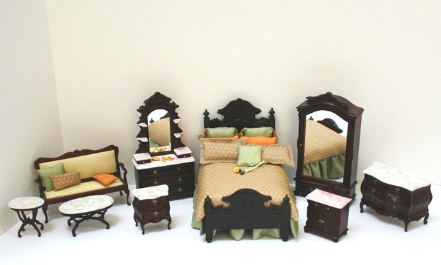 Victorian Bedroom Suite: You'll need a large bedroom to accommodate the many pieces that comprise this imported Victorian bedroom suite. The bed is dressed by Peggy Smeriglio and measures 6" H, 7"W. Also a loveseat with coord