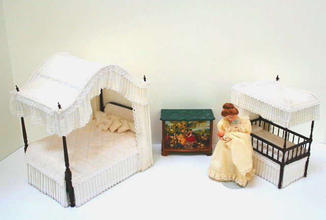 Mother and Child Bedroom: A new mother and infant by Rae Lynn Dolls 5.5" H, elegant canopy bed 8" H, 7" L with matching canopied crib and a hand-painted chest with faux marble top painted by Beth Bergmann.