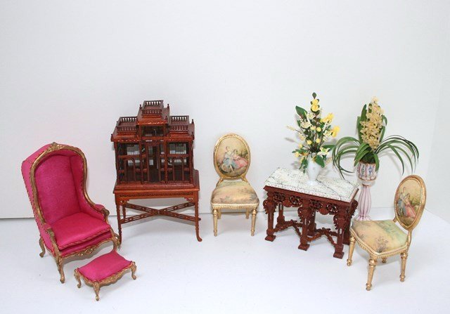Cozy Corner: An assortment of commercial furnishing for a quiet corner: a Chinese Chippendale birdcage with table 5.5" H, 3.5" W, a pretty French porter's chair and footstool re-upholstered by Studebaker Miniature