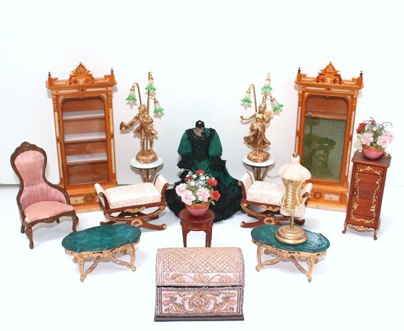 La Belle Mode: Fittings for a Victorian dress shop including two customized Eastlake-style cabinets 7" H, seating, an embroidered trunk, dress mannequin by Joanne Roberts, tables (faux marc site tabletops damaged by