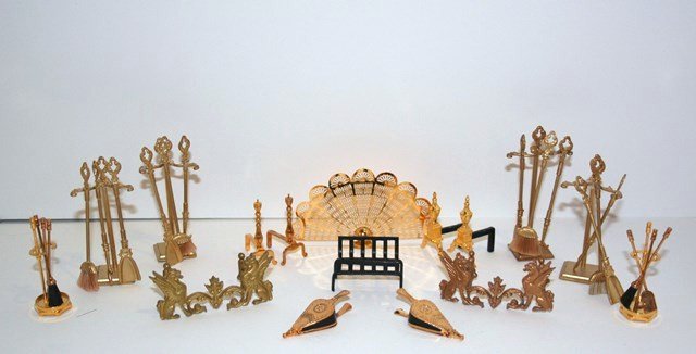Large Lot of Fireplace Accessories: A large collection of brass and gilt metal fireplace tools, andirons, grates, bellows etc. Fireplace fan 1.75" H, 3" W.
