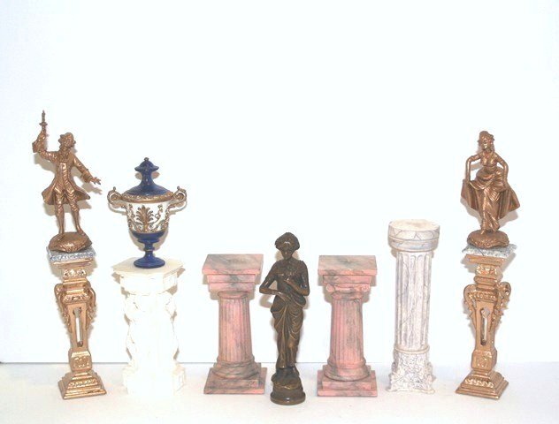 Statuary and Pedestals: An assortment of plastic and resin classical stands with faux marble effects, an urn, two gilt figures and a nice bronze-tone statue of a Renaissance woman 4.25" H.