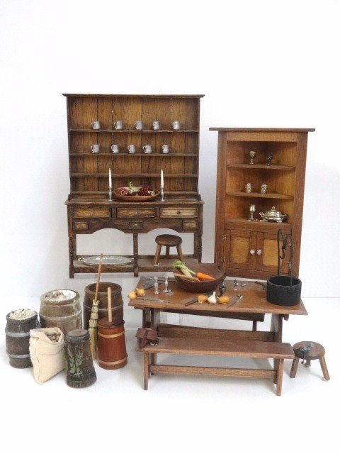 English Kitchen: Welsh dresser signed B. Goodwin 7.5" H, 5.5" W with pewter mugs, a corner cupboard, trestle table with benches by CJ's, benches and bowls by Sir Thomas Thumb and assorted accessories.