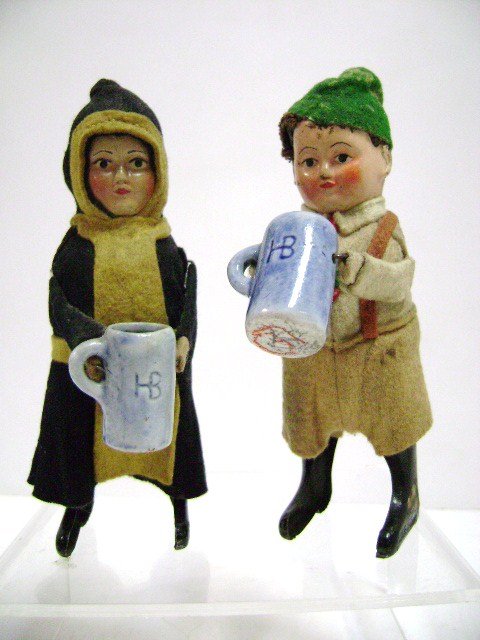 Pair Schuco European Dancers: Pair of Schuco tin wind-up drinkers, lift mug and spin in circles, 5"H, dressed in traditional felt costumes
