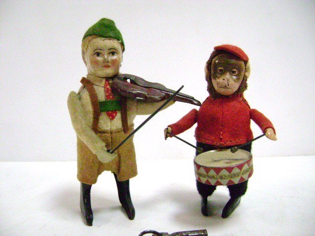 Pair Schuco Dancing Musicians: Tin wind-up dancing musician boy in ethnic costume 5"H plays violin, monkey 4.5"H plays drums