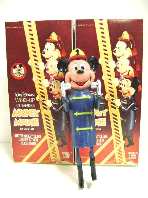 Pair Wind-up Climbing Mickey Mouse Fireman Toys Boxed: 4" x 5" x 11" box contains hard plastic toy with built in key by Durham 1970's, 9" H Mickey climbs to top of 17" two piece ladder then slides down