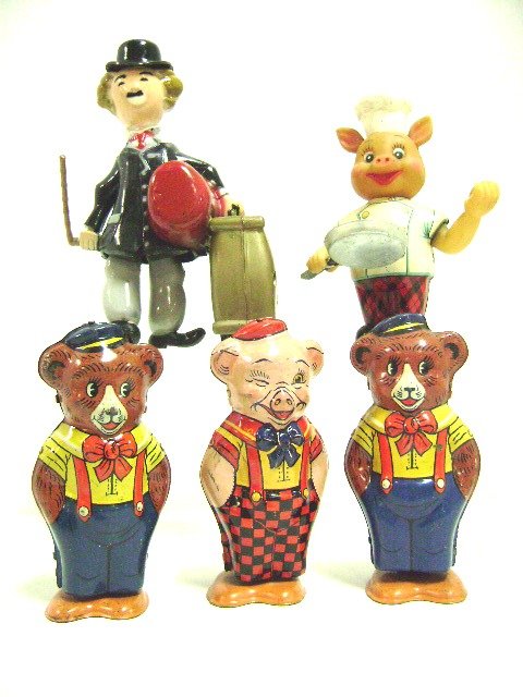 Three Chein Wind-up Walkers plus Others: Group of three J. Chein tin litho wind-up walkers 4.5" H, two bears and a pig, wind-up pig chef walker, tin and rubber 5" H, and a Spanish friction Charlie Chaplin plastic walker 7" H