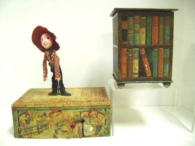 Mattel Dancing Dude and Early Biscuit Tin: Mattel Dancing Dude wind-up music box, litho paper over wood base, cloth and plastic figure, 10" H, early Huntley and Palmers English Biscuit Tin, embossed litho design of books in bookcase, 6.5" H