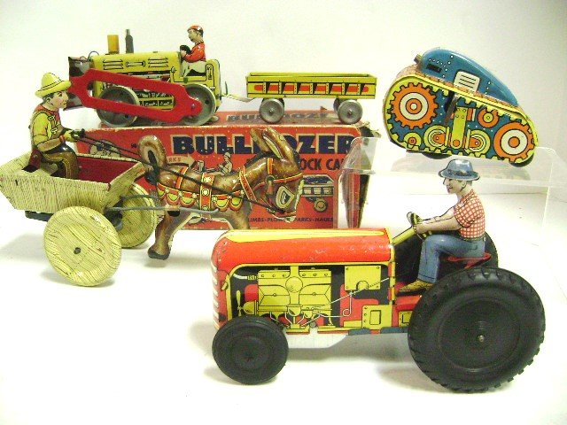Four Tin Wind-Up Vehicles: Marx Donkey Cart 8.5" L, Marx Flip Over Tank, Courtland Tractor and Ranger Bulldozer with Cart in O.B.