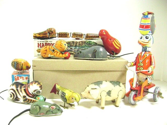 Ten Tin Wind-Up Toys: West German Duck with propeller hat riding tricycle, 2 cats, 3 birds, 2 mice and U.S. Zone Germany Pig, and alligator, tallest 9"