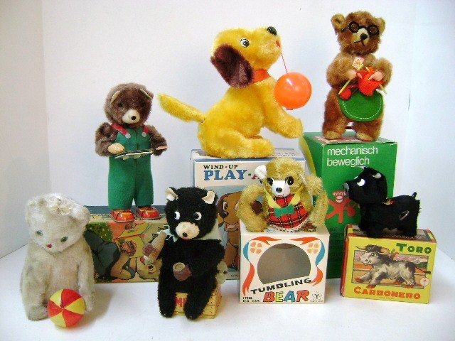 Seven Wind-Up Toy Animals: Alps Japan Cubby The Reading Bear 7" H wind-up in OB, milk drinking bear, kitten with ball wind-up, Yonezawa Tumbling Bear in OB, Spain Toro wind-up bull in OB, Alps Japan wind-up Play-A-Pup with ball