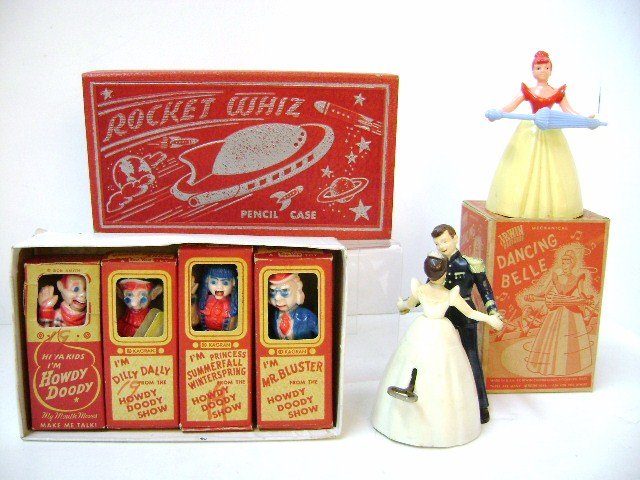 Four Howdy Doody Puppets and Others: Set of four Kagran 1950's Howdy Doody Show plastic puppets with moving mouths 4" H, two Irwin wind-up plastic dancing belles [one in original box], Rocket Whiz pencil case 8.5" L with wear on corners