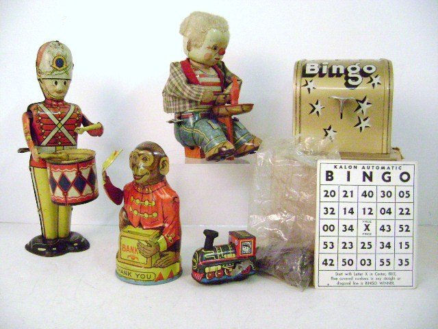 Five VintageTin Toys: Japan tin wind-up shoemaker, Marx wind-up drummer 9" H with rust, Chein monkey bank missing trap, Kalon bingo game in OB with cards and chips and small wind-up locomotive