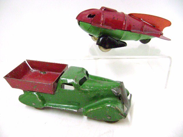 Wyandotte Space Ship and Marx Dump truck: Wyandotte pressed steel 1930's space ship 6" L with very nice original paint and Marx pressed steel dump truck 6.5" L with worn original finish