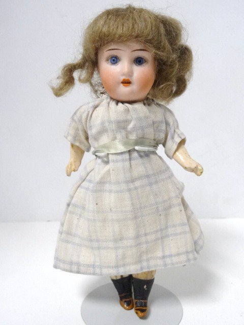 Bisque Head Doll, 8 inches: Bisque head doll, DEP R/2/0, painted eyes, original wig & clothes, composition body, 8 in. Painted composition legs.