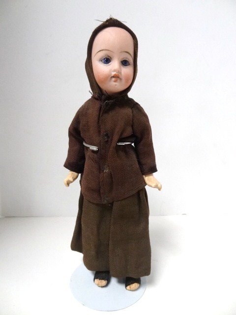 Bisque Head Doll, 8 1/2 inches: Bisque head doll, kid body, composition arms & legs, 50 11/0, made in Germany, glass eyes, teeth, redressed as Monk, 8 1/2 in.