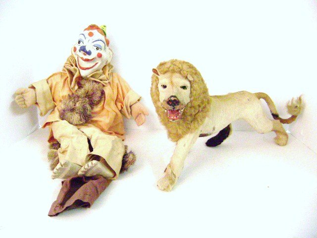 Early Lion Toy and Puppet: Realistic looking lion toy 16" L with mohair and fur over paper Mache body and paper Mache clown puppet with cloth and wood body 18" H, signed