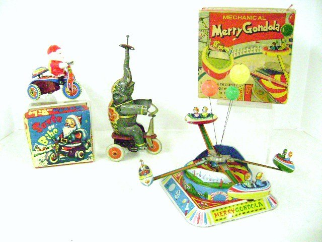 Alps Mechanical Merry Gondola Wind-Up and Others: Alps Japan tin litho Mechanical Merry Gondola wind-up in OB 9" W assembled, also Japanese celluloid and tin Santa on Bike wind-up 4" L in OB, also German wind-up elephant on trike missing ball from to
