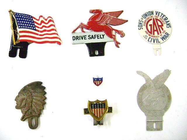 Group Early License Plate Toppers and Badges: Mobil Oil Pegasus, Grand Army of The Republic GAR Civil War Veterans badge, FOE Fraternal Order of Eagles, TOTE Totem of the Eagle Redmen, a 48 star flag topper, US Shield Topper and US Shield bolt