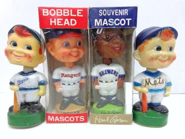 MLB Bobble Head Lot: Four bobbles to include: Danny Goodman, gold base Rangers bobble in ob, Milwaukee Brewers Hank Aaron in ob, Plastic K. C. Royals Hong Kong, N.Y. Mets bobble Marked China