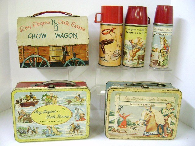 Three Roy Rogers Lunch Boxes: Three Roy Rogers lunch boxes by American Thermos Bottle Co., Roy Rogers and Dale Evans Double R Bar Ranch [two versions], and Chow Wagon, all three complete with thermoses