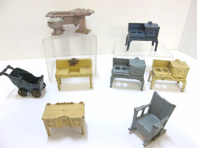 Kilgore Cast Iron Dollhouse Furniture: Group of Kilgore cast iron dollhouse miniature furniture: three stoves, washsink, buffet, rocking chair, baby buggy and three pc bathroom set....good group