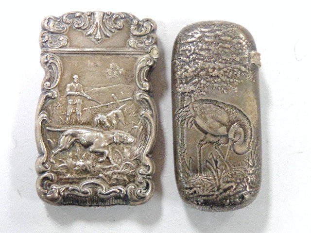 Sterling Hunting and Bird Vesta Cases: Pair of early figural sterling vesta cases, hunting scene w/man & pointer in field, 2.7 in. (h) w/monogram, case finely decorated w/crane amongst foliage, Birmingham hallmarks 2.6 in. (h)