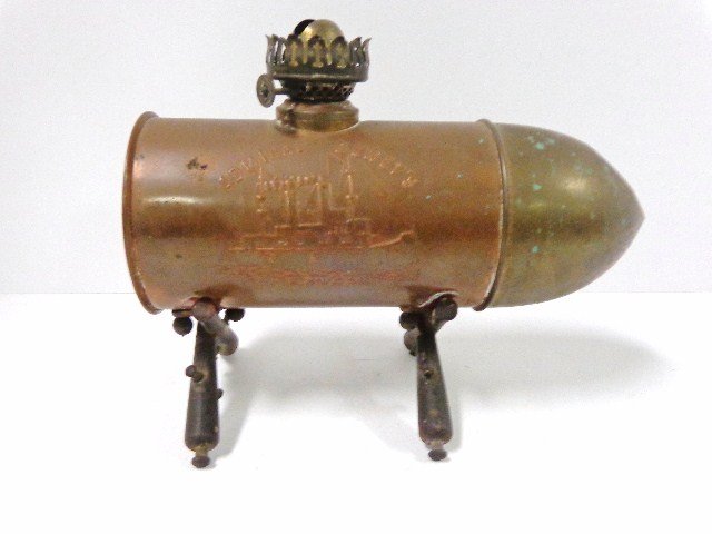 Spanish American War Shell Lamp: Figural Spanish American War commemorative oil lamp, copper body shaped like artillery shell embossed "Remember the Maine" with crossed flags & anchor on side, reverse has image of USS Maine & Admiral