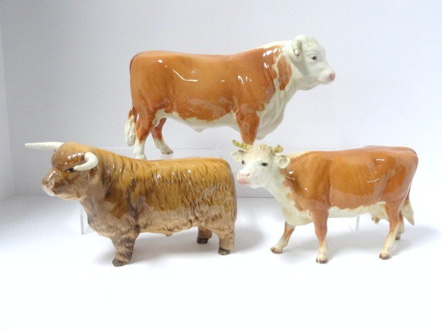 Lot of Two Beswick Bull Figurines Plus One Cow Figure: Lot of three figurines, signed Beswick Highland bull #2008, unsigned (# 3 printed on hoof) bull, unsigned Hereford cow figurine (#27 painted on hoof), last 2 figurines attributed to Beswick, tallest 5