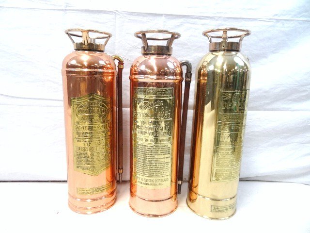Three Copper/Brass Fire Extinguishers: Three copper/brass fire extinguishers, General Model Quick Aid SA-303 Fire Guard, The Wirts Fire Extinguishing, Wirt & Knox Mfg. Co. 24 in. (t), 7 in. (w)