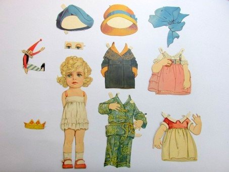 Two Early Foreign PD Sets: Two early foreign sets, 8.5" H doll with four costumes, doll 12" H with eyes added has four costumes, four hats and one toy, marked ABC 406