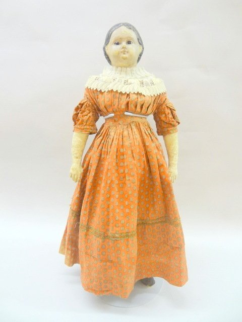 Papier Mache Glass Eye Pre Greiner Doll: Glass eye 24in. papier mache Greiner type, molded black hair, exposed ears, early pre-Greiner on a cloth body, later w/leather lower arms, appropriately dressed in period clothing